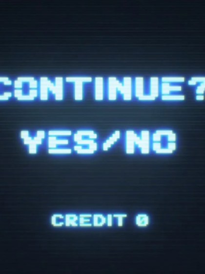 Black gaming screen with whitish/bluish letters that say "Continue? Yes/No"