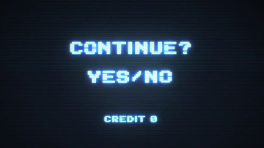 Black gaming screen with whitish/bluish letters that say "Continue? Yes/No"