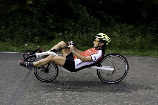 A man on a recumbent bike